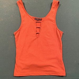 Orange/brown tank top shirt. Slightly ribbed.
